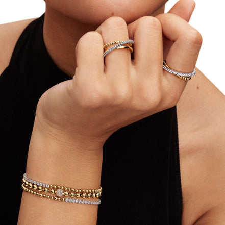 Überkreuzter Ring mit Kugeln und Pavé