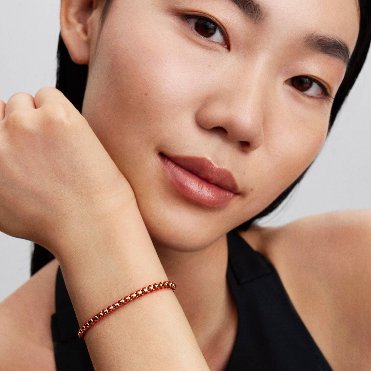 Armband rote Kordel goldfarben